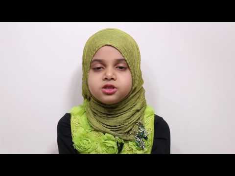 a small girl reciting quran with tajweed